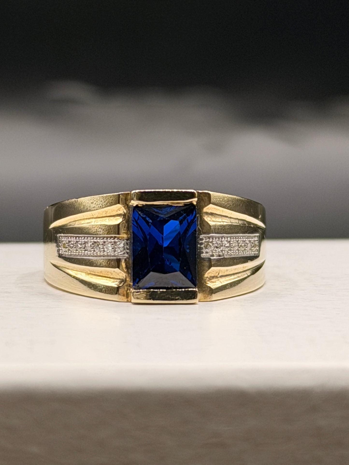 Men 10k yellow gold statement ring with blue center stone