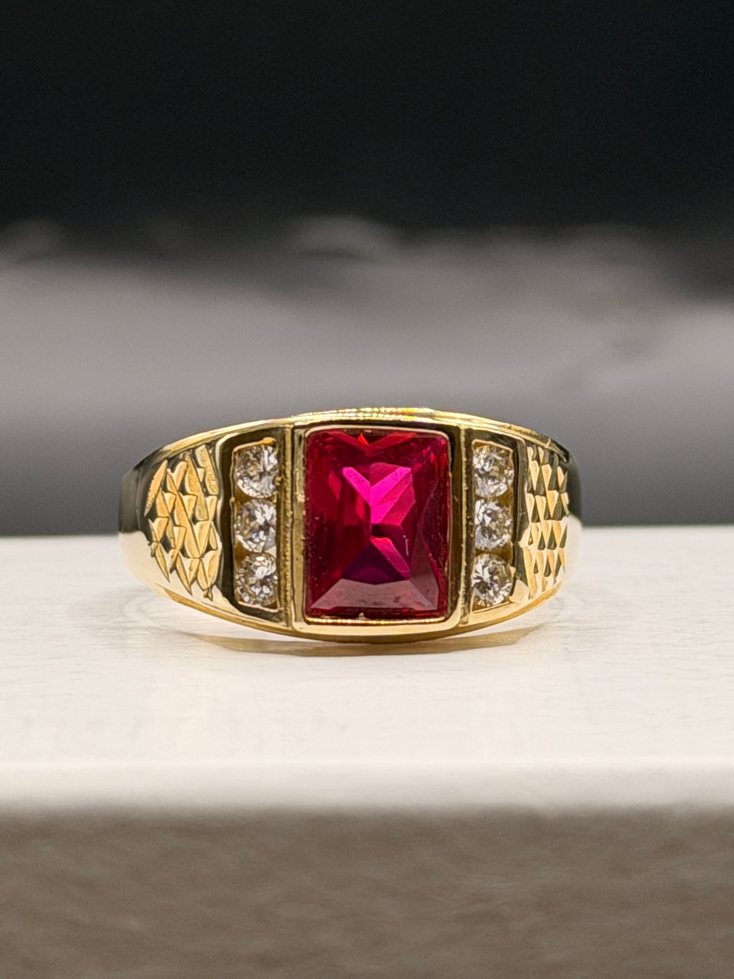 Men’s 10k yellow gold red stone ring with CZ accents
