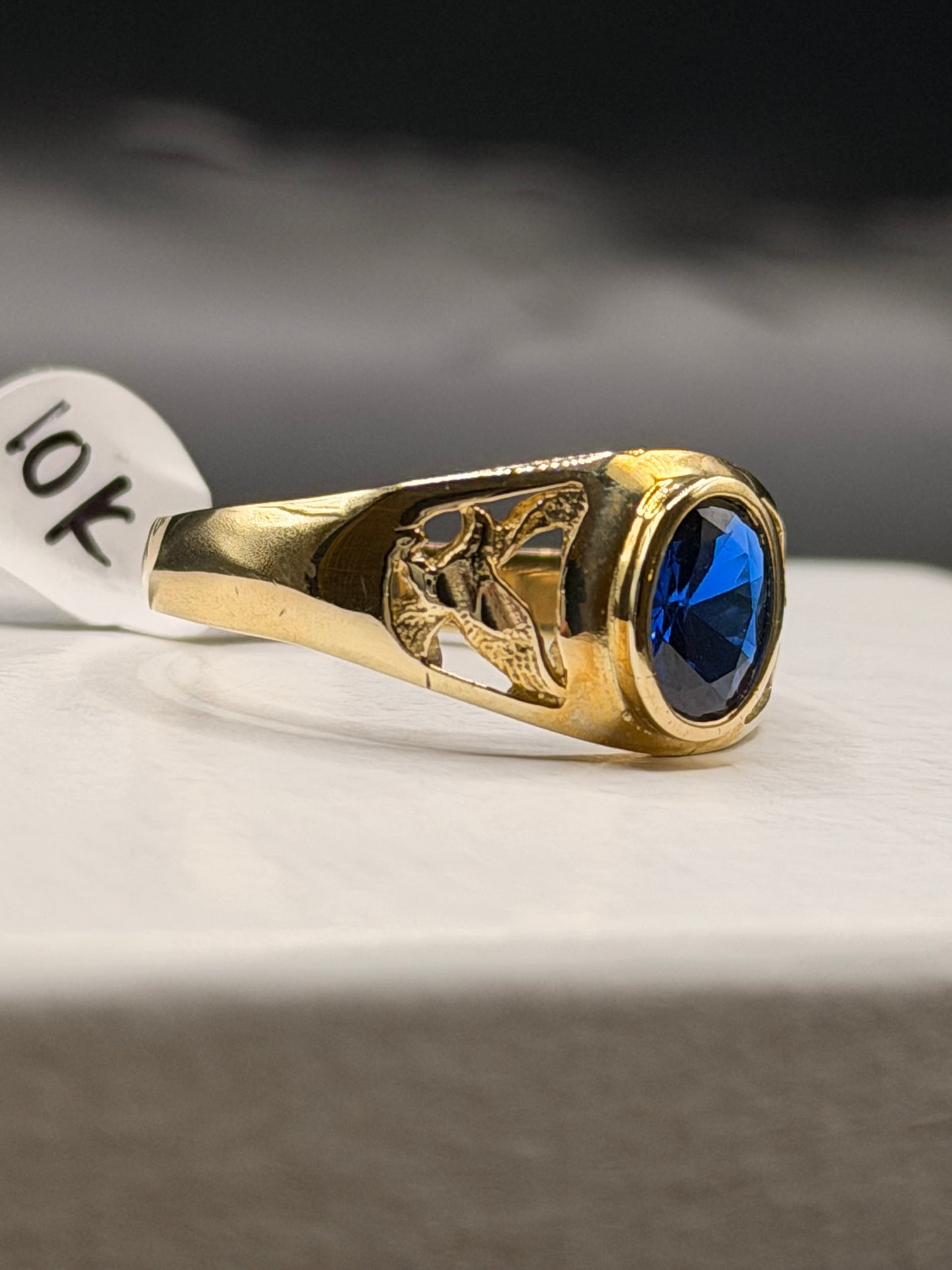 Men’s 10k gold oval blue stone ring with eagle design
